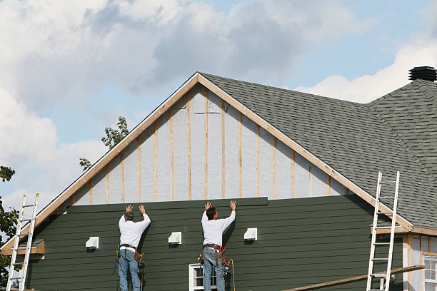 Professional Siding technician working in Ferguson, NC
